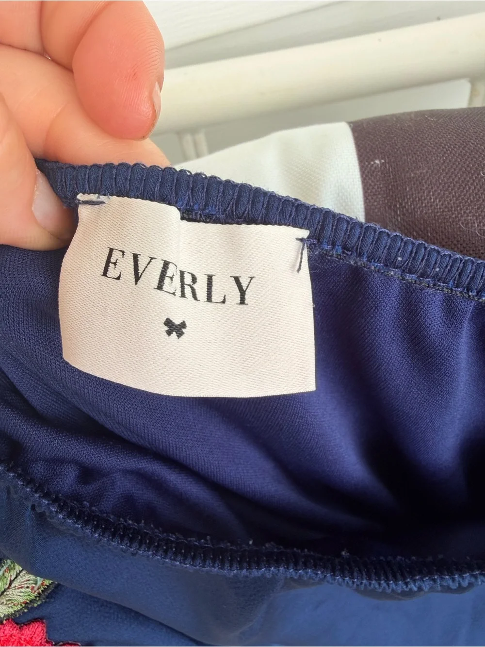 Everly Navy Romper with Rose Embellishment